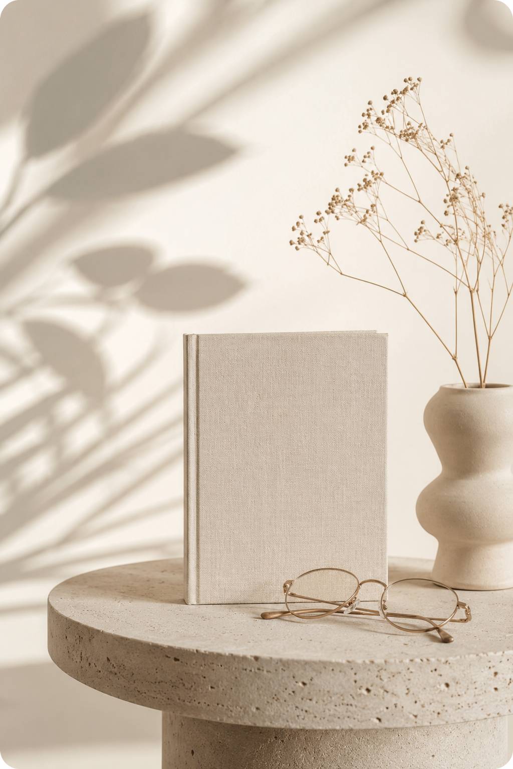 Warm still life with books, plant, and soft natural light