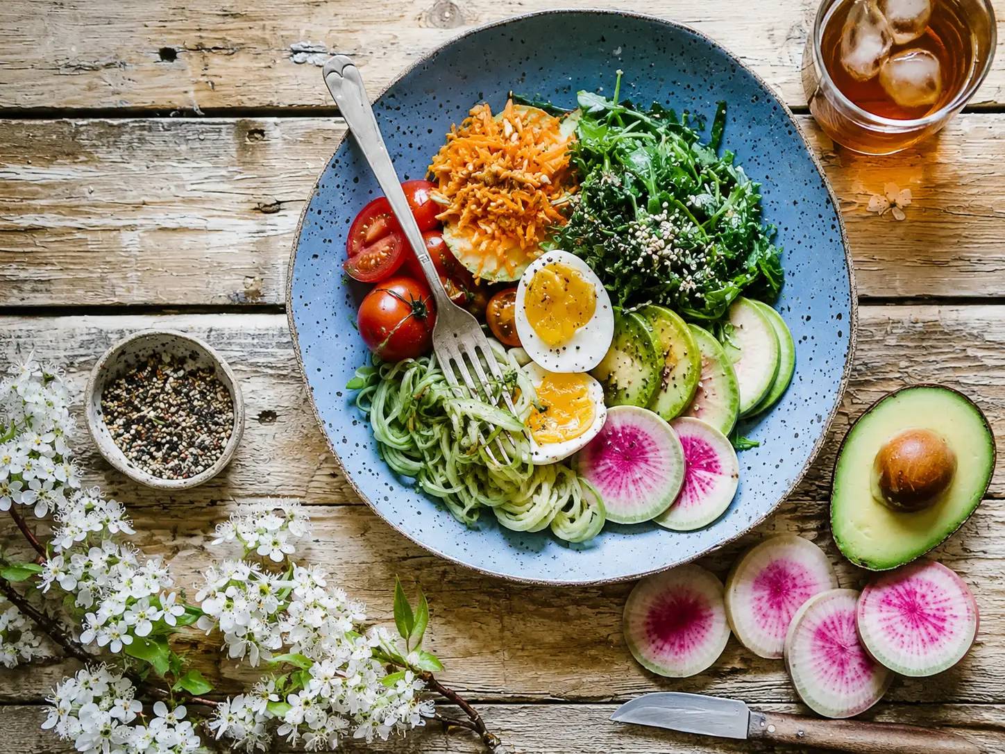 Healthy breakfast with eggs, avocado, and greens